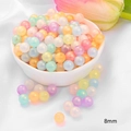 Detailed macro view of 8mm acrylic pastel beads in a ceramic bowl for DIY jewelry making - Round Beads / 8mm (Approx. 120 Pieces/Pack) / Jelly Iridescent