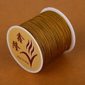 Goudbruin gevlochten koord op een witte spoel voor DIY sieraden en armbanden - 1 Stuk / Aardgeel