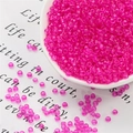 Translucent rose red seed beads in a white tray for handmade jewelry weaving and DIY projects - 3mm 20g/Pack Approx 700 Pcs / Rose Red