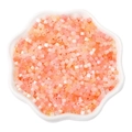 Mix of 2.5mm orange and pink cat eye seed beads in a white bowl for DIY jewelry - 2.5mm Hole 1mm 10g/pack Approx 740pcs / Orange Series