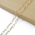 Close-up of shiny gold rectangular paperclip chain links for DIY jewelry making - Box Wire Chain (5mm) / KC Gold