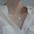 Minimalist S925 sterling silver gold necklace featuring a LUCKY rectangular pendant on model - 925 Silver / Gold