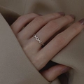 Minimalist S925 sterling silver chain link ring worn by a model on a neutral fabric base - Adjustable Open / Silver