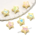 Macro detail of star-shaped acrylic beads with colorful letters for DIY jewelry making - Approx. 19mm Thickness 12mm Aperture 2mm (1 Piece) / Yellow - Random Letters