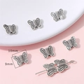 Dijes de mariposa plateados vintage para hacer joyas DIY con dimensiones de 10mm x 9mm - Mariposa / Paquete de 40