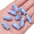 Handmade light purple ceramic fish-shaped beads for DIY jewelry making in palm - 10x19mm (2 Pieces/Pack) / Blue