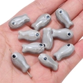 Gray fish-shaped ceramic beads for DIY jewelry making shown in hand for size - 10x19mm (2 Pieces/Pack) / Light Gray