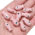 Pink ceramic fish-shaped beads for DIY jewelry making held in palm for size scale - 10x19mm (2 Pieces/Pack) / Light Pink