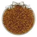 Handmade amber glass seed beads displayed in a silver bow tray for DIY jewelry - Dark Gold