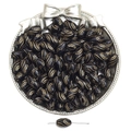 Macro detail of black and gold oval acrylic beads with leaf textures for DIY jewelry - Spiral Olive Style / 50 Pieces/Pack (7x13mm)