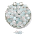 Detailed view of gradient blue and white resin cat eye beads on a silver bow tray - Blue Pink