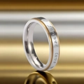 Close-up of two-tone stainless steel ring with 'Forever love' engraving and heart pattern - Size 9 / Female Style / Silver-Gold Mix