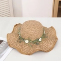 Khaki straw sun hat with large wavy brim and floral daisy wreath for beach vacations - Artemisia (pola) Kaki