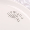 Silver open jump rings for DIY jewelry making on white ceramic plate background - 5mm Jump Ring (200 Pieces/Pack)