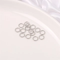 Set of 15 silver stainless steel open jump rings for DIY jewelry making on white plate - 6mm Jump Ring (200 Pieces/Pack)