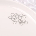 Polished silver stainless steel jump rings for DIY jewelry making on white tray - 7mm Jump Ring (200 Pieces/Pack)