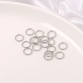 Silver open jump rings for DIY jewelry making scattered on white ceramic plate - 8mm Jump Ring (200 Pieces/Pack)