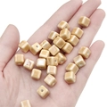Handheld view of small caramel glazed ceramic cube beads for DIY jewelry making - Light Coffee