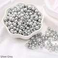 Silver-grey faux pearls in a ceramic bowl for DIY jewelry making and craft projects - Diameter 3-8mm Hole Approx 1mm 50g/Bag Approx 750 Pcs / Silver Gray