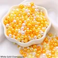 Mix of white gold and champagne ABS pearl beads for DIY jewelry making in a white bowl - Diameter 3-8mm Hole Approx 1mm 50g/Bag Approx 750 Pcs / Rhodium Plated Champagne