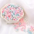 Pastel pink, blue, and white ABS faux pearl beads for DIY jewelry making in a petal bowl - Diameter 3-8mm Hole Approx 1mm 50g/Bag Approx 750 Pcs / Crystal Love Mix