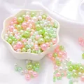 Assorted size ABS pearl beads in pink green and white in a ceramic bowl for DIY crafts - Diameter 3-8mm Hole Approx 1mm 50g/Bag Approx 750 Pcs / Spring Spirit