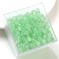 Light green glass jelly beads in a transparent plastic storage box for DIY jewelry - Light Green