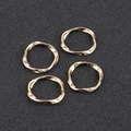 Macro shot of four irregular twisted gold alloy circular pendants for DIY jewelry making - Set of 4 / Mini Gold (Approx 17mm)
