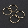 Macro view of four twisted gold alloy geometric rings for DIY earring jewelry making - Set of 4 / Medium Gold (Approx 32mm)