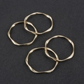 Detailed view of four golden irregular wavy alloy rings for DIY jewelry making accessories - Set of 4 / Large Gold (Approx 42mm)