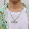 Close-up of hip hop silver QUEEN letter pendant with tennis chain on a model - Silver Tennis Chain