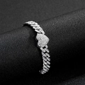 Detailed macro view of silver Cuban link bracelet with iced out heart centerpiece - Silver Bracelet (18cm)
