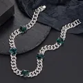 Close-up of Cuban link necklace with emerald green hearts and pavé set white zircons - 50cm / Silver Necklace