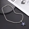 Macro detail of iced-out star pendant with blue and white zircons on tennis chain - Silver Royal Blue Star + 50cm Tennis Chain