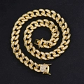 Macro shot of 15mm gold Cuban link chain with baguette-cut rhinestones on black background - Bracelet 8inch (20cm) / Gold White Rhinestone Cuban Link