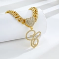 Detail of gold Cuban link chain with iced-out heart clasp and diamond letter G pendant - Golden Letter C