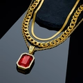 Macro view of gold layered chains with large rectangular red gemstone pendant - Red Pendant Jewelry Set (Gold)