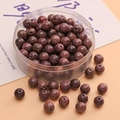 DIY handmade dark reddish-brown wooden round beads with natural wood grain in a clear box - Violet