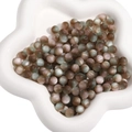 DIY mixed resin cat eye beads in matte dark brown and grey-green tones in star tray - Coffee