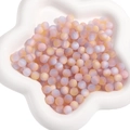Frosted lavender and pink resin cat eye beads in a star-shaped ceramic tray - Light Pink and Light Blue Mix