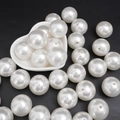 Polished white ABS imitation pearls in a white heart-shaped dish for DIY jewelry - 25mm (500g/Pack) / White