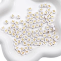 White 7mm acrylic alphabet bead with golden letter M in a ceramic tray for DIY jewelry - M White with Gold Letter