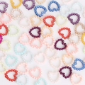 Close-up of colorful heart-shaped ABS pearl beads for DIY craft and nail art accessories - Hollow Heart Style / 11mm (Approx. 100 Pieces/Pack) / Random Mixed Colors