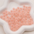 Frosted peach pink acrylic beads in a white star ceramic tray for DIY jewelry making - 8mm (50pcs/Pack) / Frosted Orange Pink