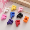 Colorful acrylic letter F beads for DIY jewelry with large hole on leather background - Letter F
