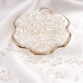 Polished rice-shaped white imitation pearls in a decorative tray for DIY jewelry - Rice Bead / 4x8mm 100 Pieces/Pack / Beige