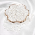 Rice-shaped beige faux pearls on a gold-rimmed petal tray for DIY jewelry making - Rice Bead / 3x6mm 100 Pieces/Pack / White