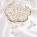 Glossy white round imitation pearl beads for DIY jewelry making in a decorative glass dish - Round Shape / 10mm 100 Pcs / Beige
