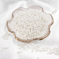 Polished beige ABS faux pearls in a decorative glass bowl for DIY jewelry making - Round Shape / 3mm 400 Pieces/Pack / White