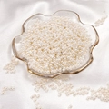 Polished cream-white irregular faux pearls in a gold-edged glass dish for DIY jewelry - Round Shape / 3mm 400 Pieces/Pack / Beige